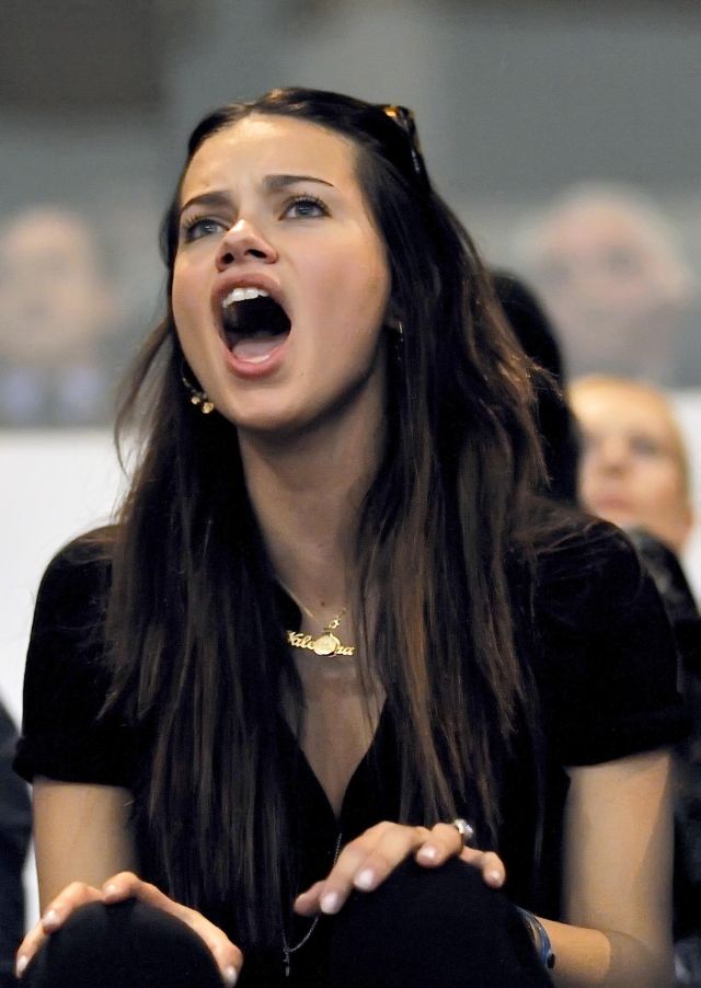 7 Adriana Lima Making Funny Faces While Watching Her Husband Playing 