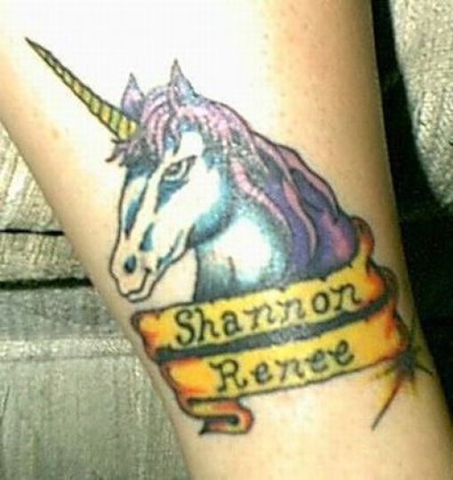 small unicorn tattoo by dublin ireland tattoo artist 'Pluto' on her side