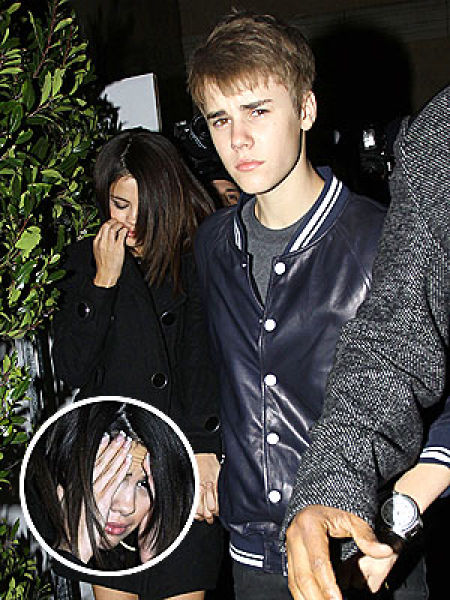 justin bieber eating a flower. justin bieber beats up selena