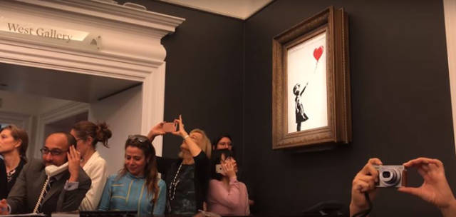 Banksy’s “Girl With Balloon” Is Sold For $1M, But That’s Where Banksy Does His Trick