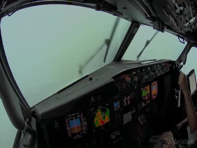 Cockpit Perspective Of Boeing 737 Landing During Thunderstorm