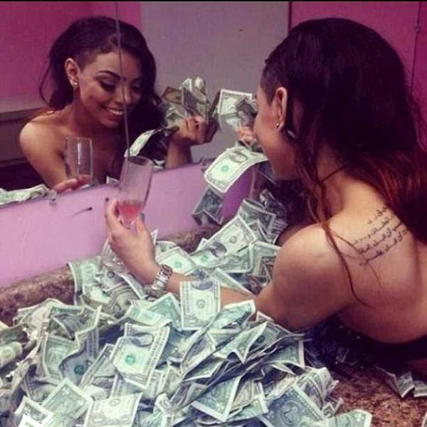 Do You Think These Strippers Bathing In Banknotes Are Really That Rich?