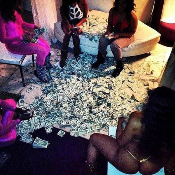 Do You Think These Strippers Bathing In Banknotes Are Really That Rich?