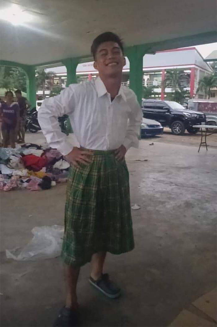 Filipinos Aren’t Shy To Pose In Mismatched Clothes They Got From Taal Volcano Donations