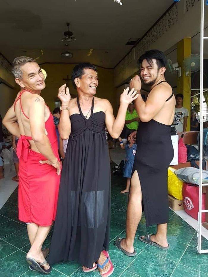 Filipinos Aren’t Shy To Pose In Mismatched Clothes They Got From Taal Volcano Donations