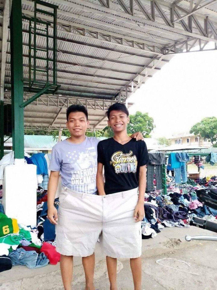 Filipinos Aren’t Shy To Pose In Mismatched Clothes They Got From Taal Volcano Donations