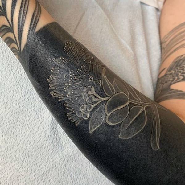 Elevating the Blackout Tattoo Trend with Renaissance-Inspired Blossoms