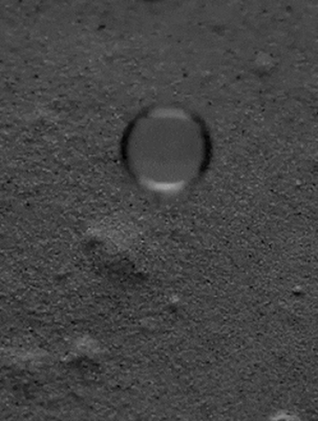 An Interesting Behavior Of A Water Droplet When Falling Into Glass Powder