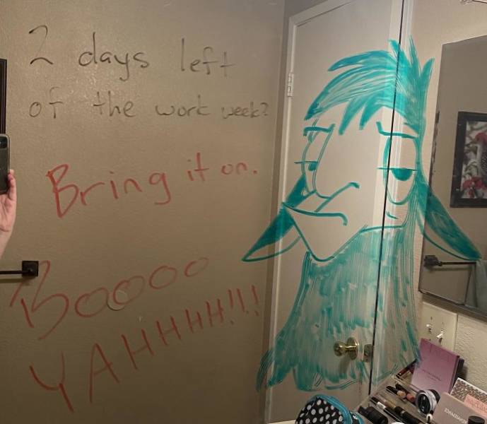 Woman Shows Doodles That Her Husband Is Drawing On Their Mirror