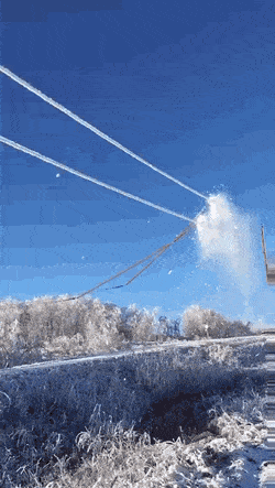 Cleaning Snow Off The Wires