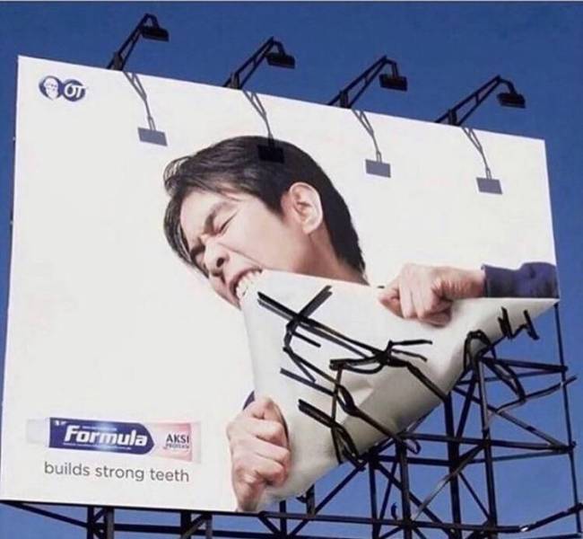 Creative toothpaste commercial on a billboard.