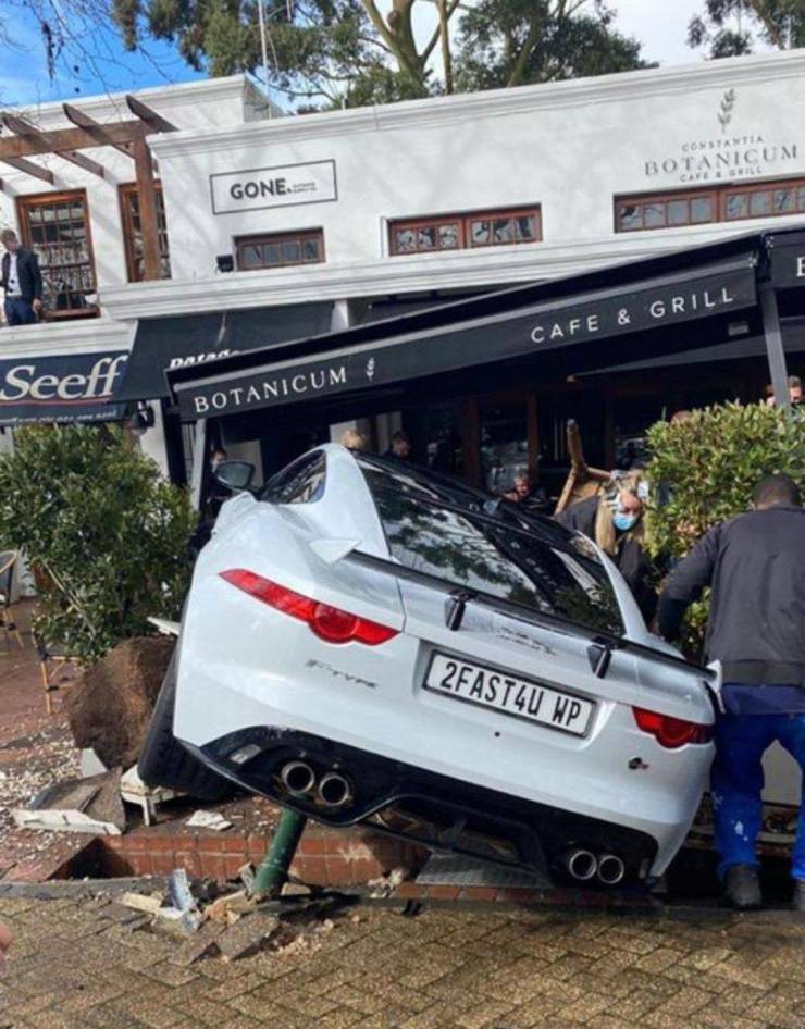 A Jaguar car with a license plate "2FAST4U" drove into the territory of the cafe.