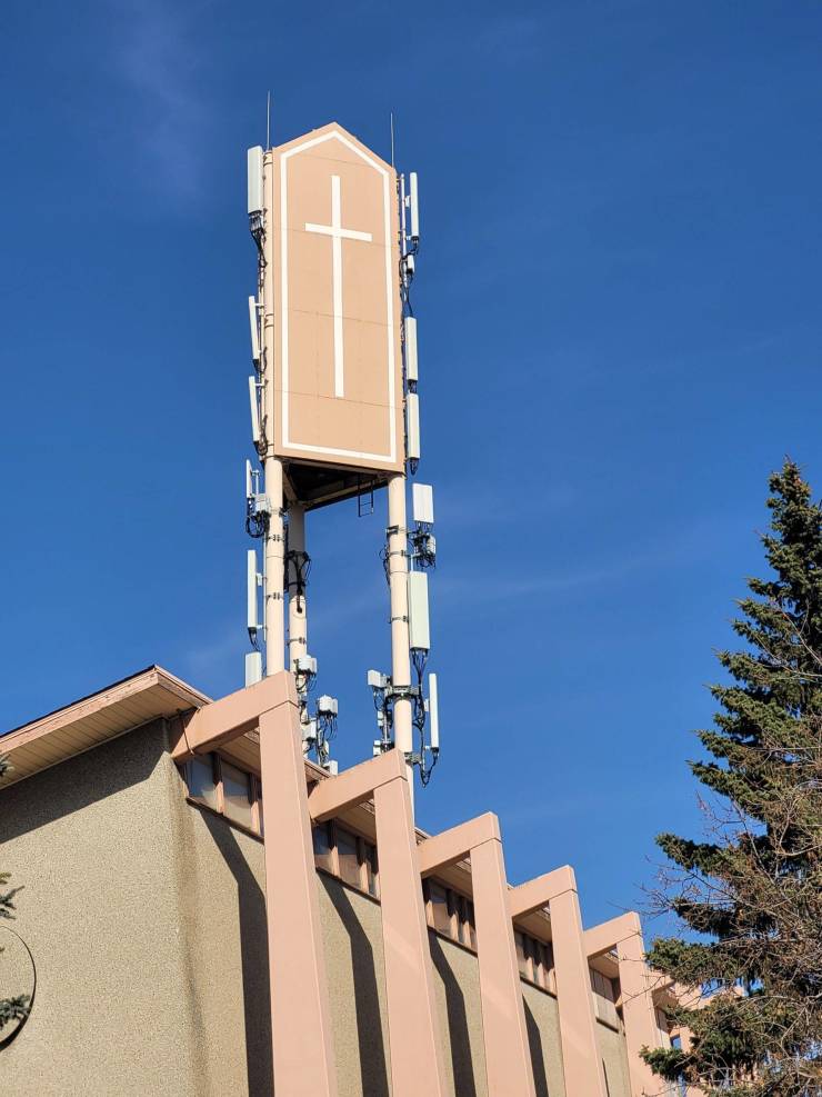 Sign of church installed on extension poles.