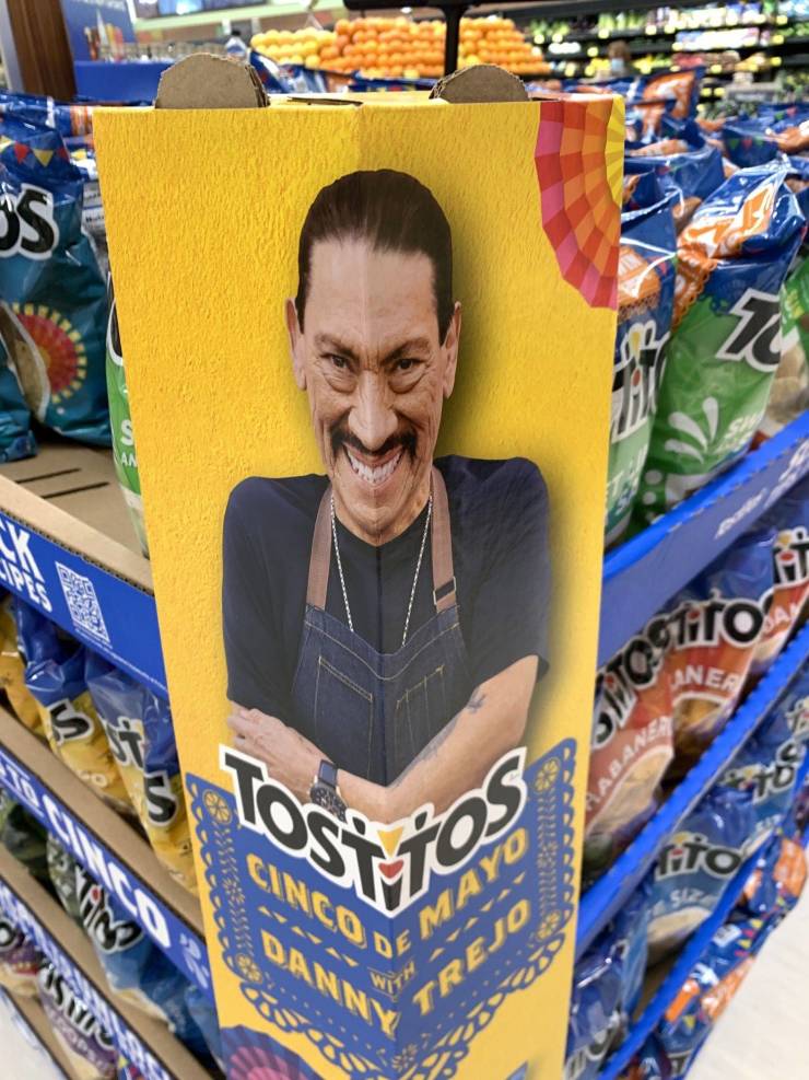 A chip advert with Danny Trejo face bent in the middle.