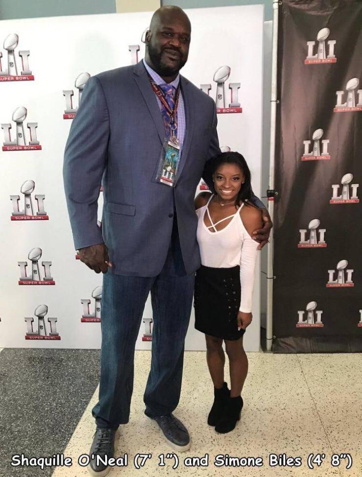 Huge Shaquille ONeal and his tiny girlfriend, Nicole Hoopz Alexander.