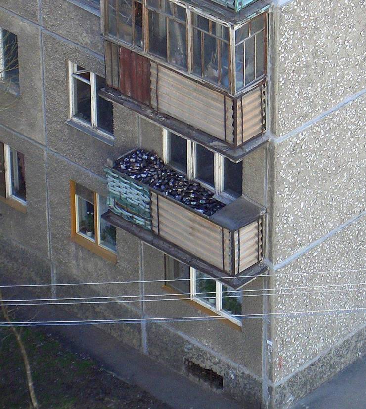 A top view of a balcony filled with empty bottles.