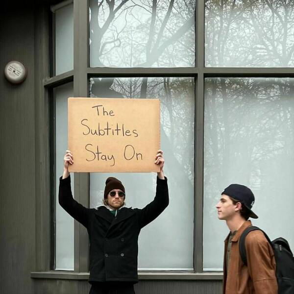 Dude With Sign” Never Stops Protesting Stuff…