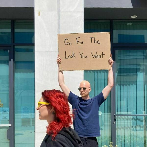 Dude With Sign” Never Stops Protesting Stuff…