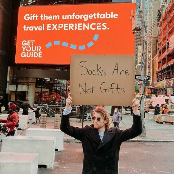 Dude With Sign” Never Stops Protesting Stuff…