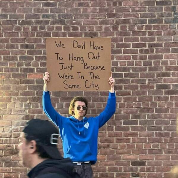Dude With Sign” Never Stops Protesting Stuff…