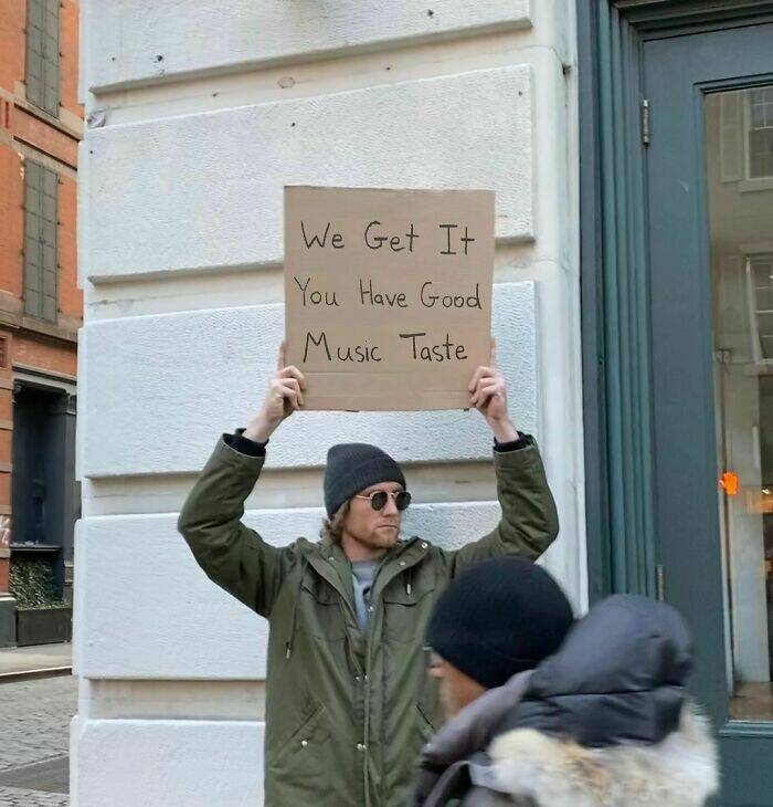 Dude With Sign” Never Stops Protesting Stuff…