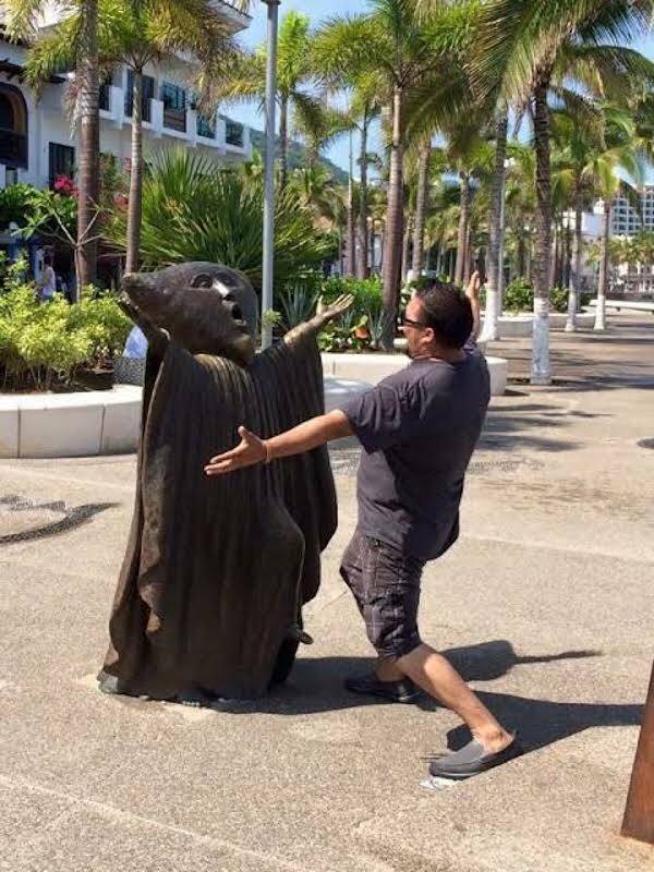 People Goofing Around With Statues