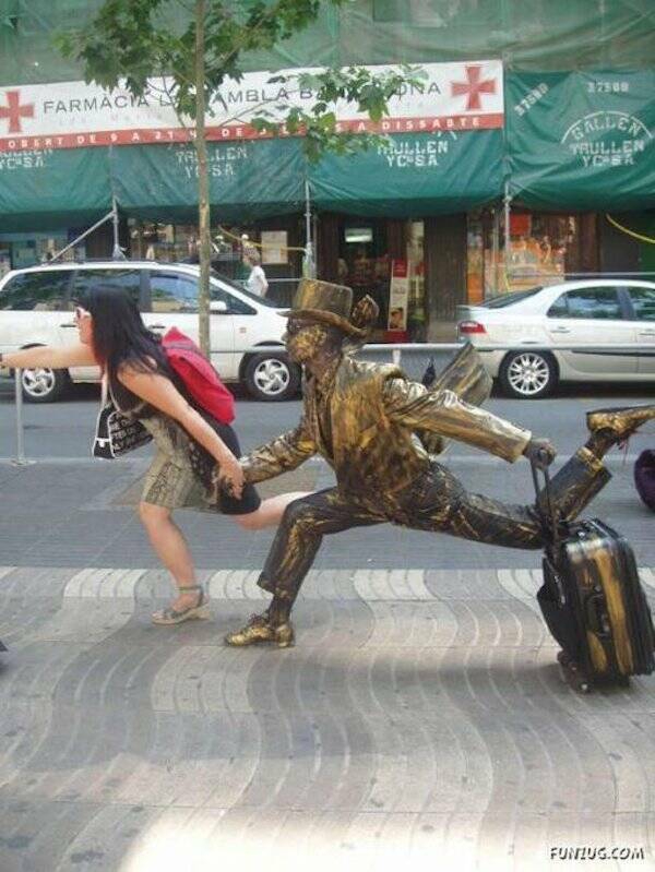 People Goofing Around With Statues