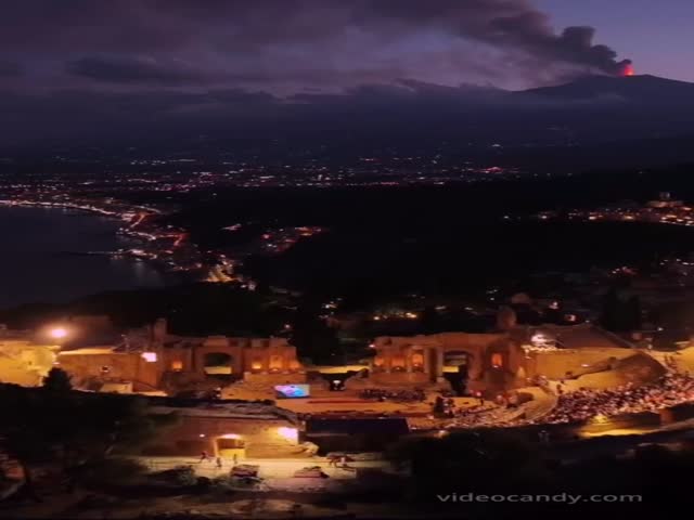 Classical Music Concert In Sicily In The Ancient Theater Of Taormina In Front Of The Erupting Volcano Etna