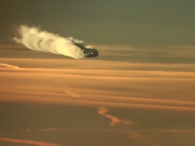 Aerial View Of Another Airplanes Contrails As It Passes By