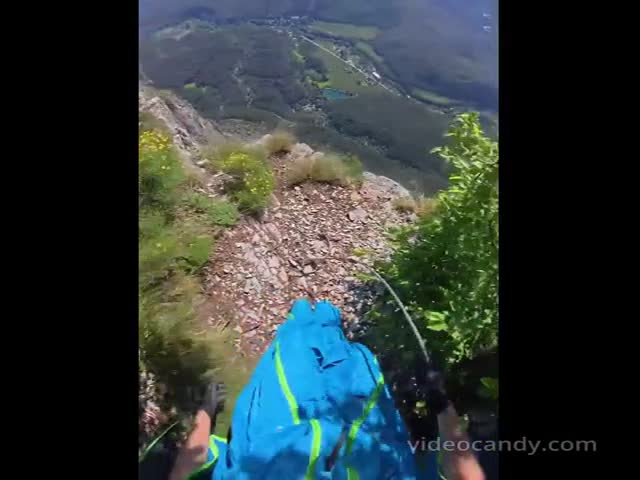 First-Person Perspective Of A Base Jump From Cliff To Smooth Landing