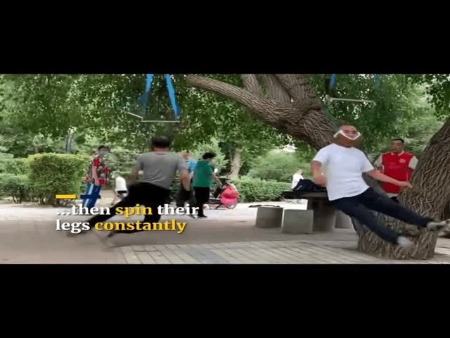 Elderly People in China Swinging Their Bodies to Treat Spinal Pain