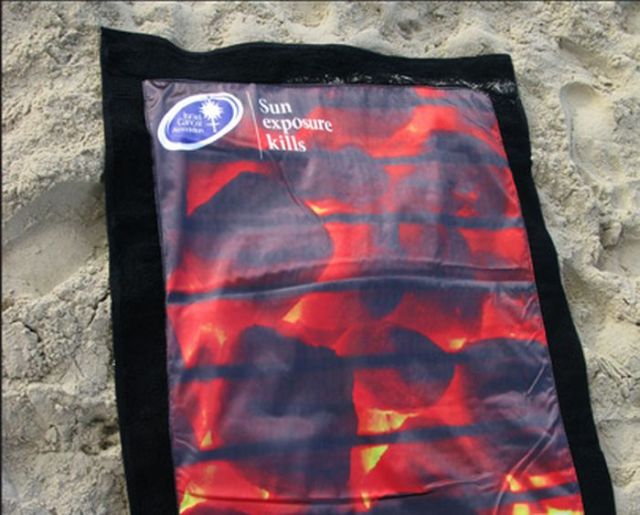 Beach towels that warns people about damage of sun exposure (6 pics)