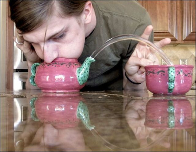 Unusual contest for blowing water out from a teapot (18 pics)