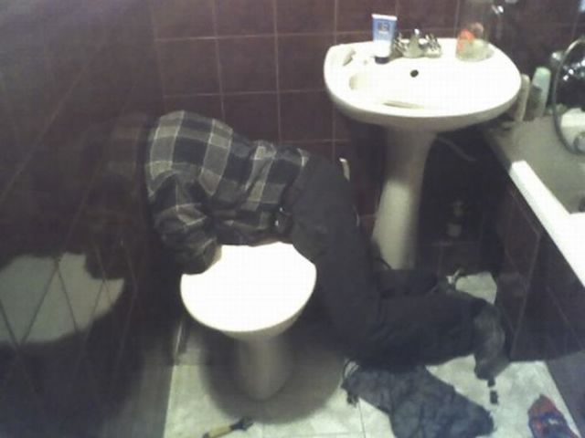 Headless Plumber in the Toilet (2 pics)