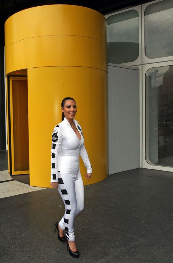 Kim Kardashian in a Tight Racing Suit (8 pics)