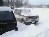 Driver Escapes from Snow Bank the Wrong Way