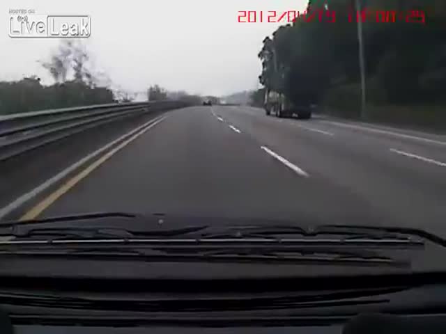 Truck Tire Bursts Out on Highway 
