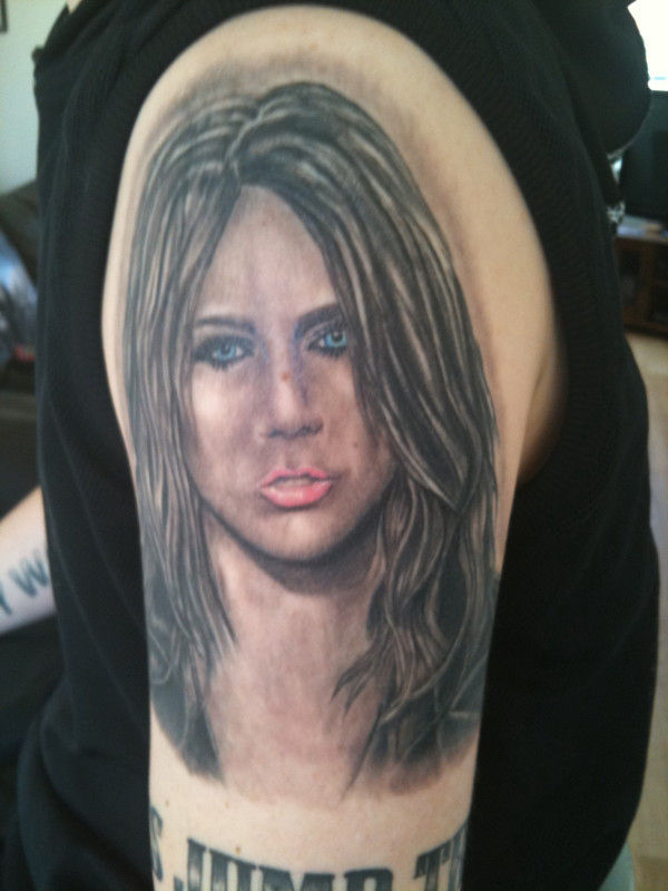 Miley Cyrus’ Adult Superfan Has 15 Tattoos of Her