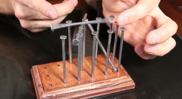 How to Balance 14 Nails on a Single Nail Head