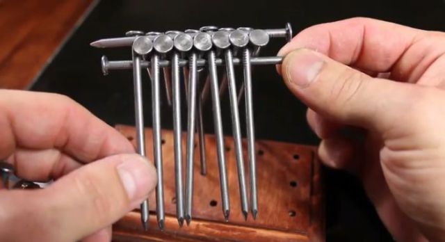 How to Balance 14 Nails on a Single Nail Head