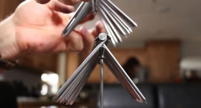 How to Balance 14 Nails on a Single Nail Head