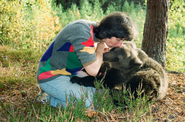 Latvian Woman Raises Wild Bear Cub Alongside Her Children