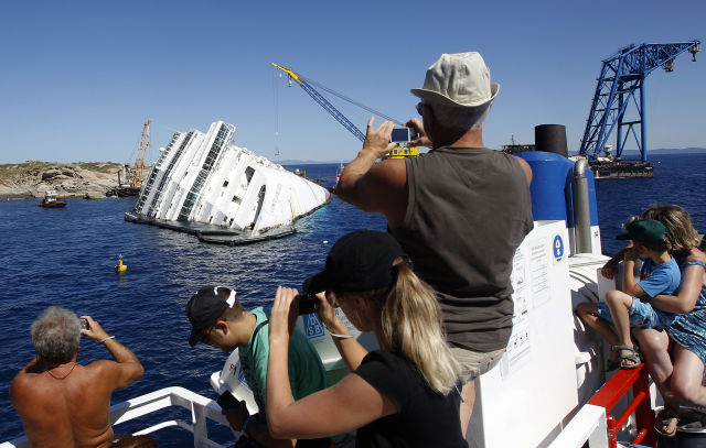 Capsized Costa Concordia Became a Weird Tourist Attraction