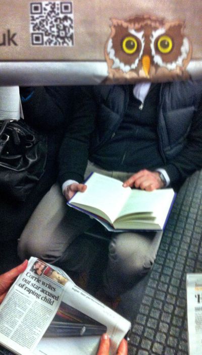 Funny Newspaper Photobombs Amuse This Bored Commuter