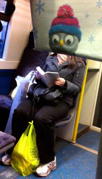 Funny Newspaper Photobombs Amuse This Bored Commuter