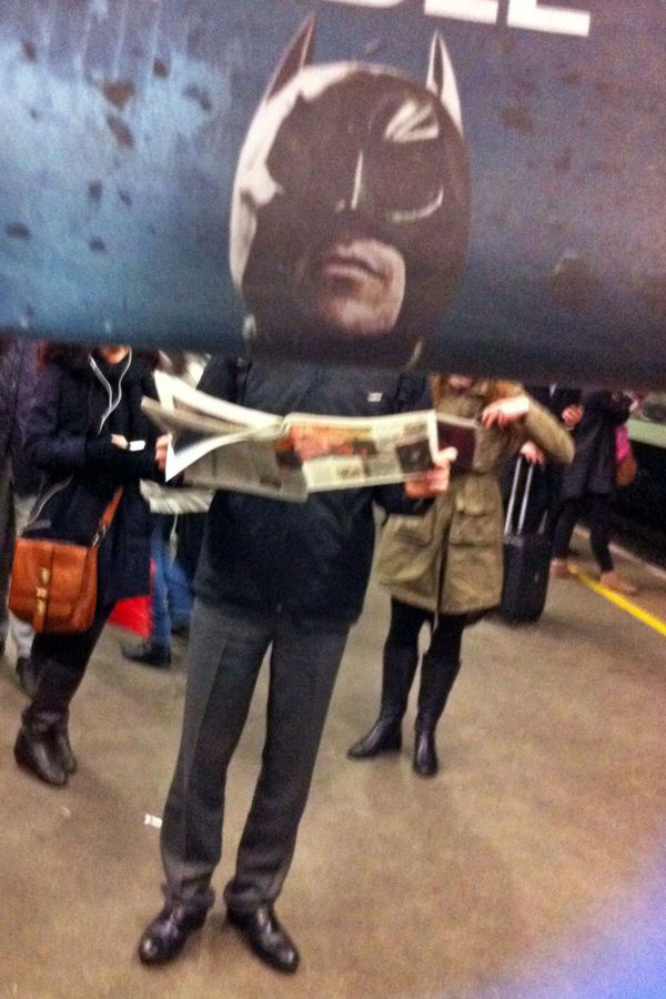 Funny Newspaper Photobombs Amuse This Bored Commuter