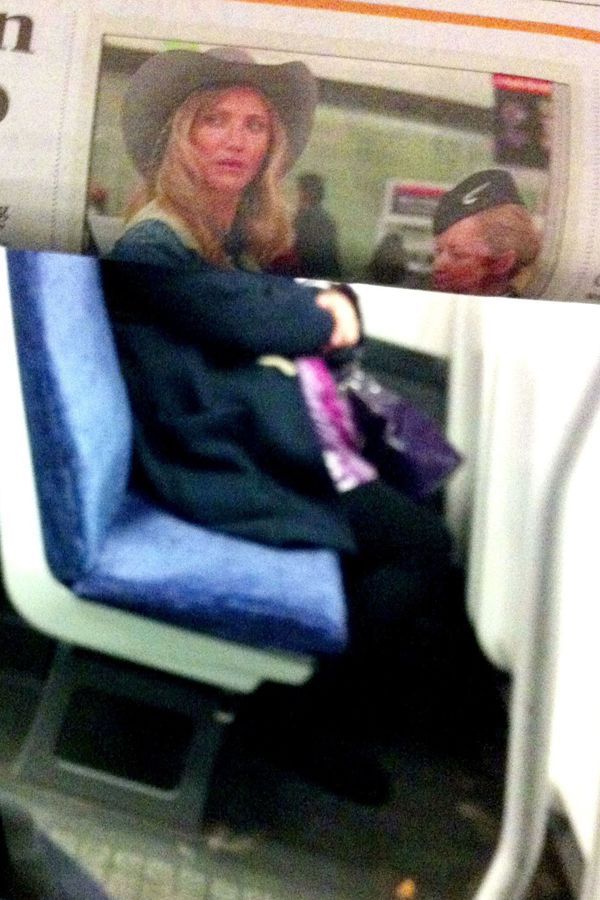 Funny Newspaper Photobombs Amuse This Bored Commuter