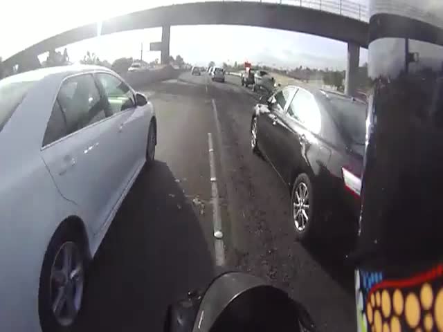 Biker Helps Car Driver on the Freeway 