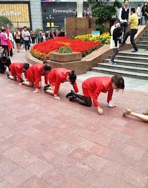 It’s Guessing Time: Why Are These People on Their Knees?