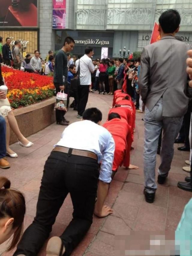 It’s Guessing Time: Why Are These People on Their Knees?